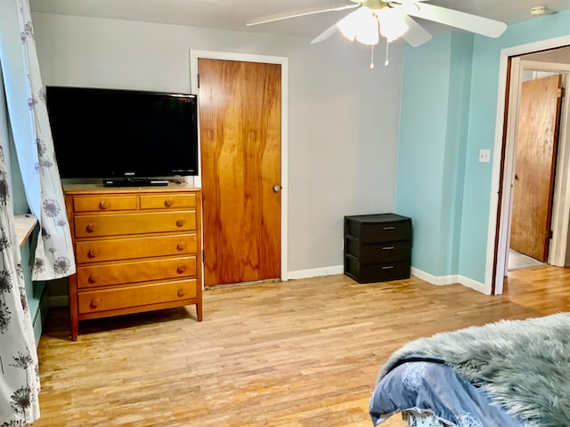 bedroom featuring ceiling fan and light hardwood / wood-style floors