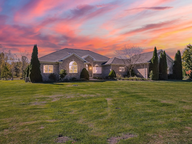 ranch-style house with a yard