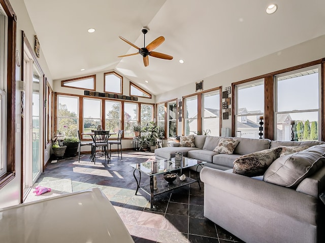 sunroom / solarium featuring ceiling fan and lofted ceiling