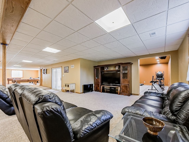 living room with a drop ceiling