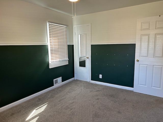 spare room with carpet flooring