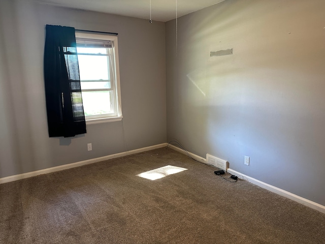 unfurnished room featuring carpet flooring