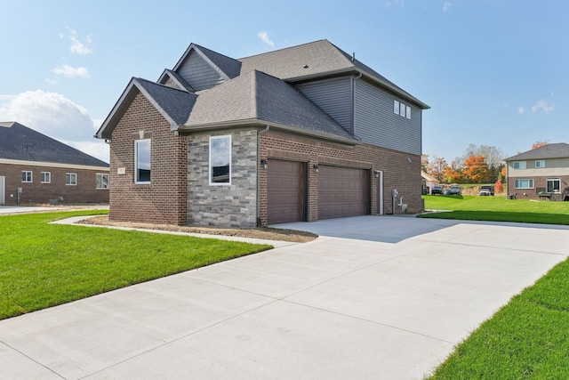 view of home's exterior with a lawn, driveway, roof with shingles, an attached garage, and brick siding