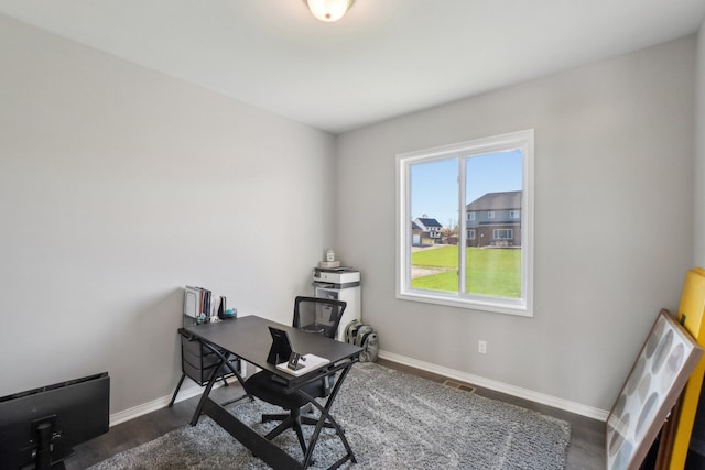 office area featuring visible vents, baseboards, and dark wood-style flooring