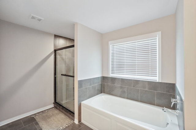 full bath with baseboards, visible vents, tile patterned flooring, a shower stall, and a bath