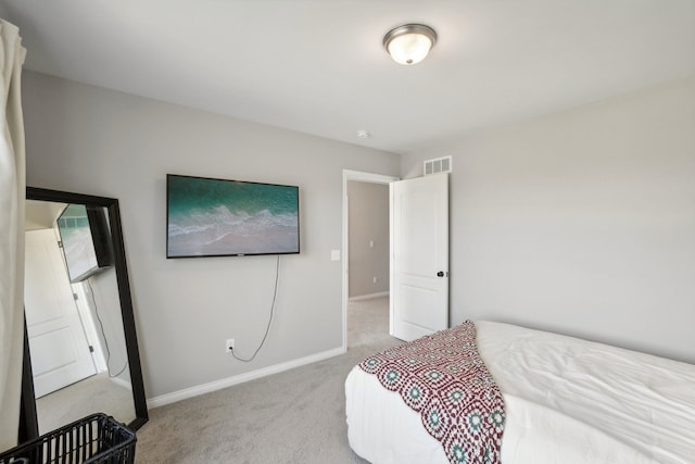 bedroom featuring visible vents, baseboards, and carpet