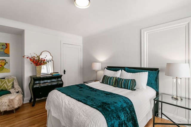 bedroom with light wood-type flooring