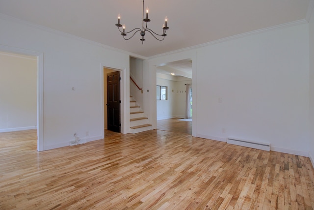 empty room featuring light hardwood / wood-style floors, crown molding, and an inviting chandelier