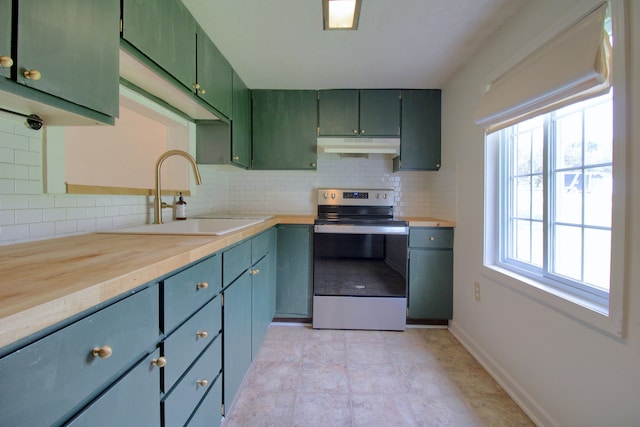 kitchen with decorative backsplash, wood counters, sink, electric range, and green cabinetry