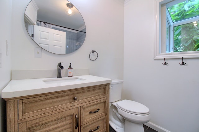 bathroom with vanity, a shower with shower curtain, and toilet