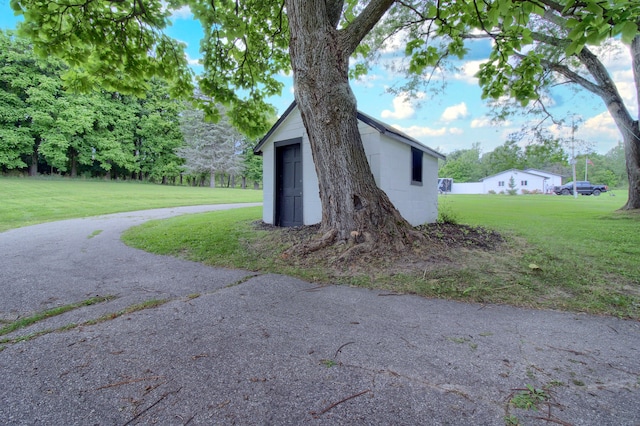 view of property exterior featuring a lawn