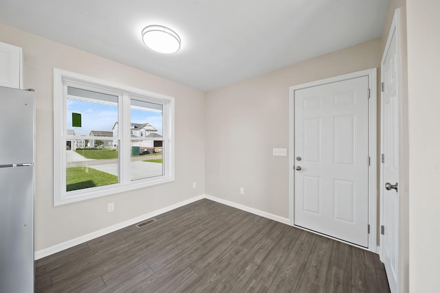 empty room with dark wood-type flooring