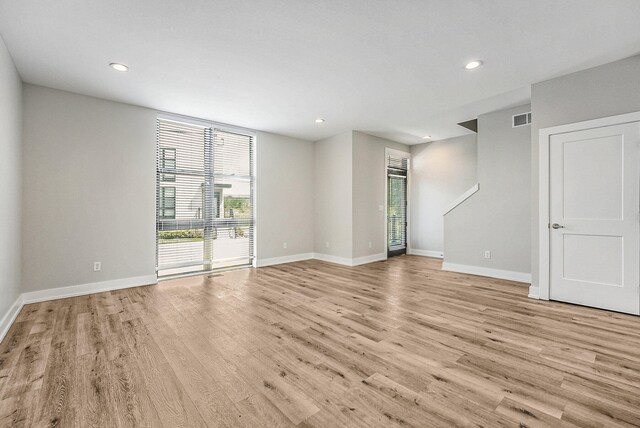 spare room with light hardwood / wood-style floors