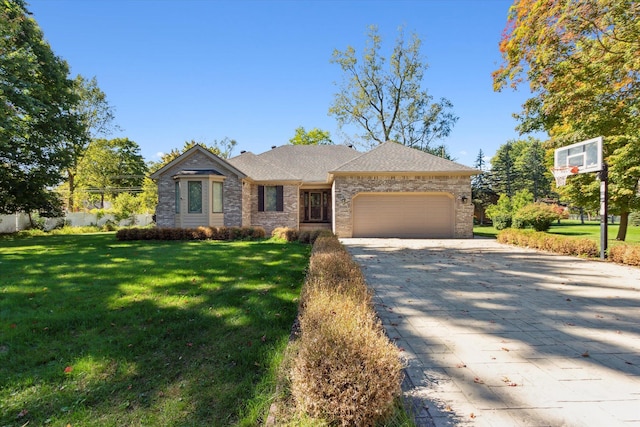 view of front facade featuring a garage and a front lawn