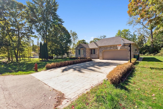 ranch-style home with a garage and a front yard