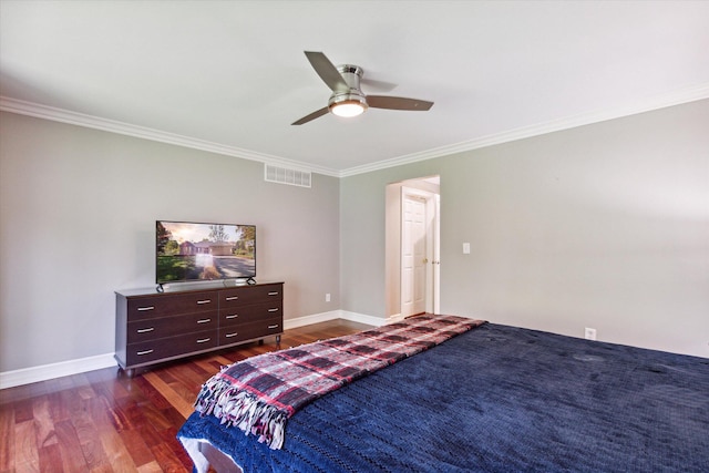 bedroom featuring dark hardwood / wood-style flooring, ceiling fan, and crown molding