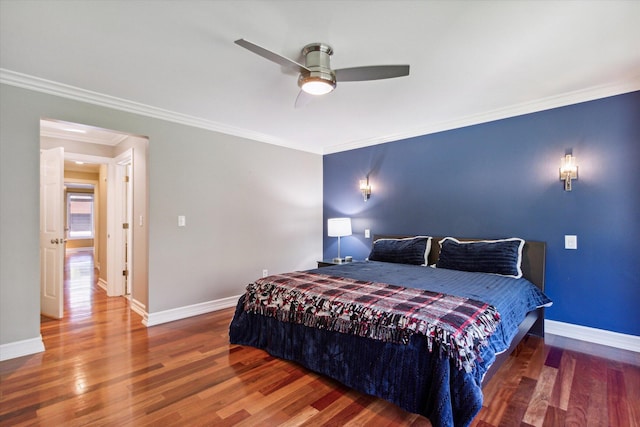 bedroom featuring ceiling fan, crown molding, and wood-type flooring