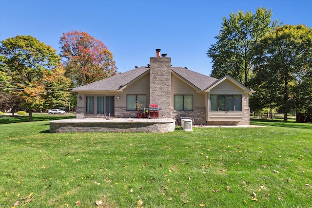 back of house featuring a patio, cooling unit, and a lawn