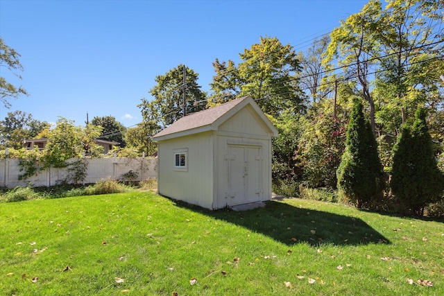 view of outdoor structure with a lawn