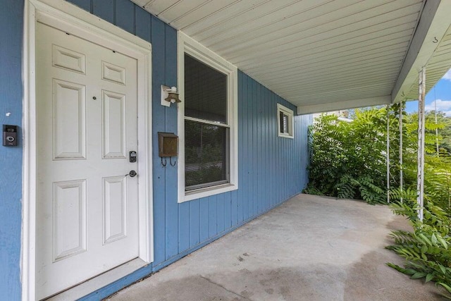 doorway to property with a porch