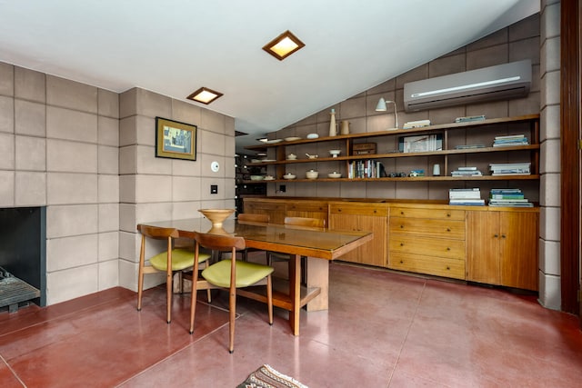 office with vaulted ceiling, an AC wall unit, and tile walls