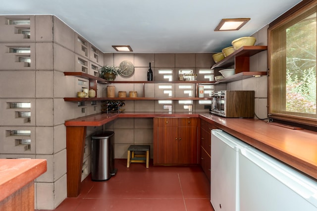 kitchen featuring white fridge and tile patterned floors