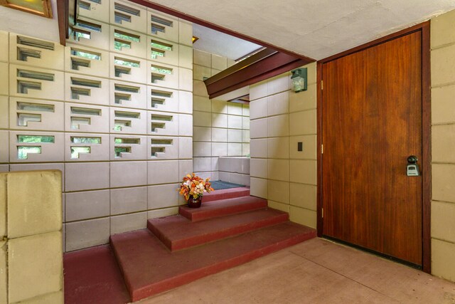 stairway with tile walls