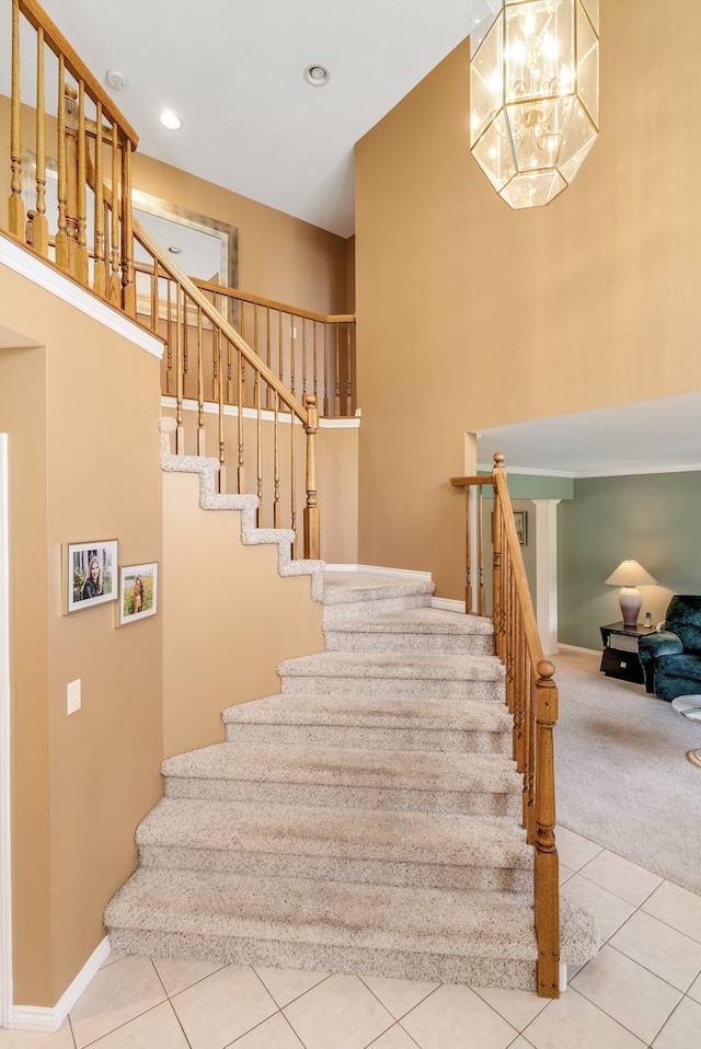 stairs featuring carpet floors and a chandelier