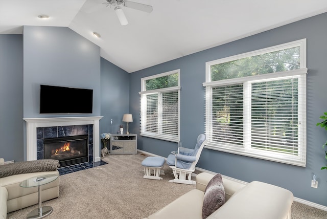 living room featuring carpet, ceiling fan, lofted ceiling, and a fireplace