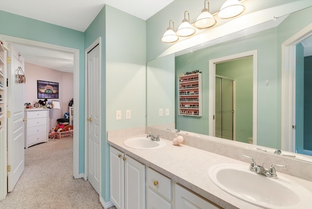 bathroom with vanity and walk in shower