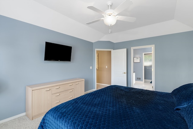 carpeted bedroom with vaulted ceiling and ceiling fan