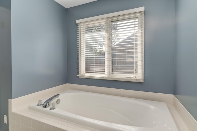 bathroom with tiled tub