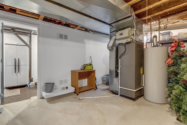 basement featuring heating unit and gas water heater