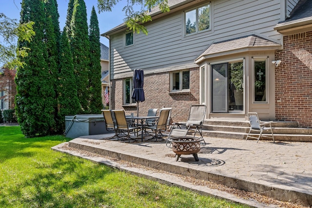 view of patio / terrace featuring an outdoor fire pit