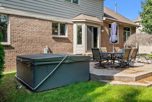 view of patio / terrace featuring a hot tub