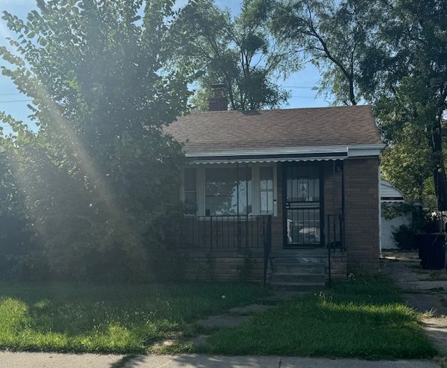 16813 Tireman St, Detroit, MI 48228 - bungalow featuring a chimney, a porch, and a shingled roof
