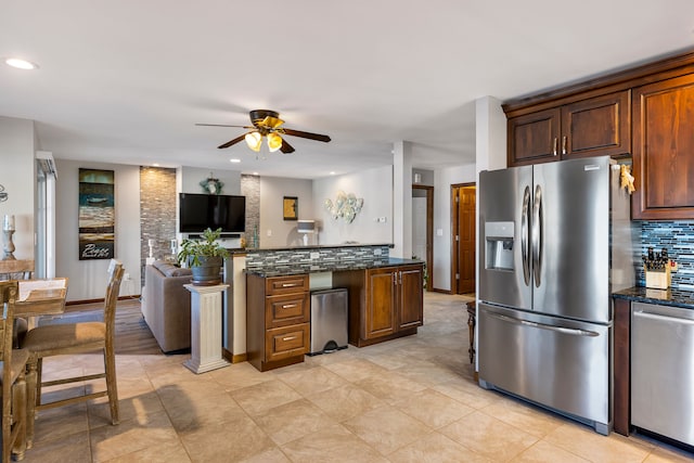 22461 Milner St, Saint Clair Shores, MI 48081 - kitchen featuring a ceiling fan, tasteful backsplash, stainless steel appliances, recessed lighting, and dark stone counters
