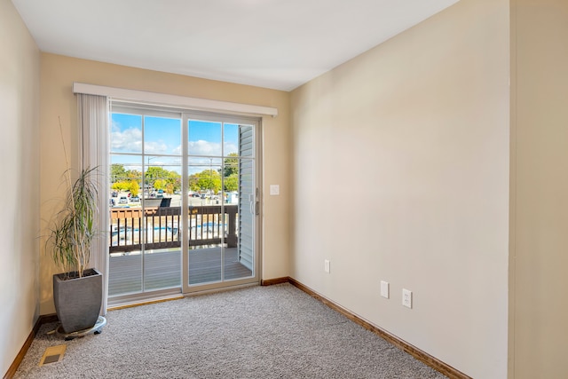 22461 Milner St, Saint Clair Shores, MI 48081 - empty room featuring baseboards, visible vents, and carpet