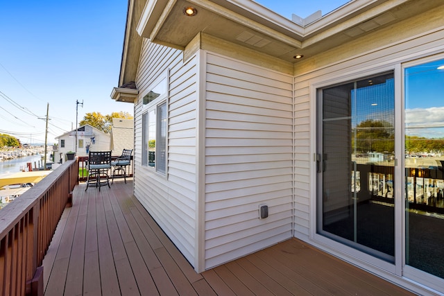 22461 Milner St, Saint Clair Shores, MI 48081 - wooden deck featuring outdoor dining area and a water view