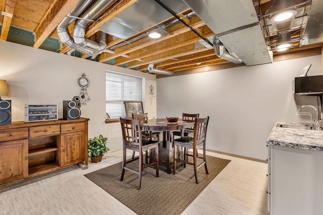 22461 Milner St, Saint Clair Shores, MI 48081 - dining space with baseboards and light wood-style floors