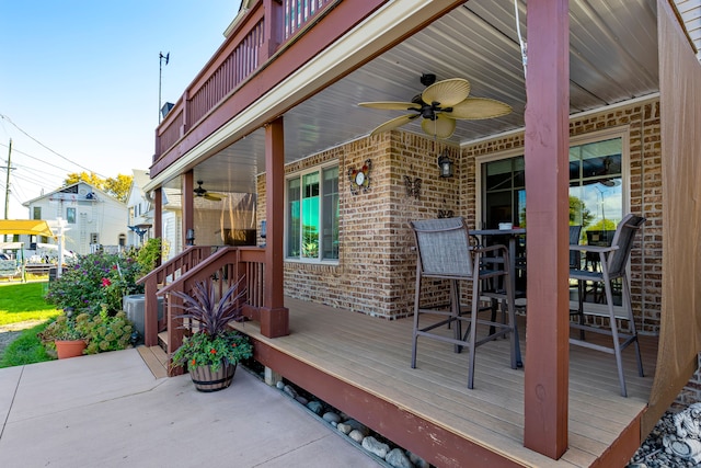 22461 Milner St, Saint Clair Shores, MI 48081 - deck featuring central air condition unit, outdoor dining area, and a ceiling fan
