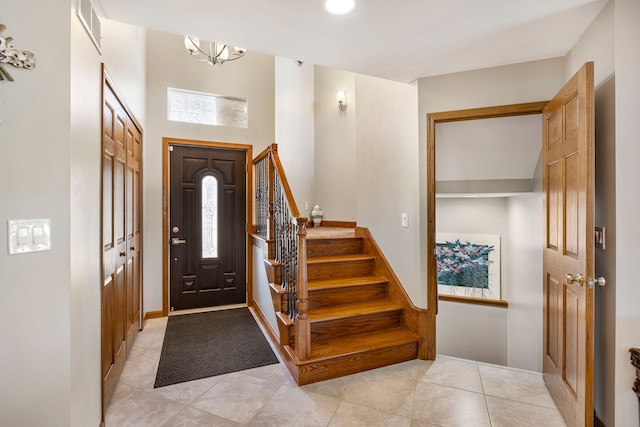 22461 Milner St, Saint Clair Shores, MI 48081 - foyer featuring light tile patterned flooring, visible vents, and stairway