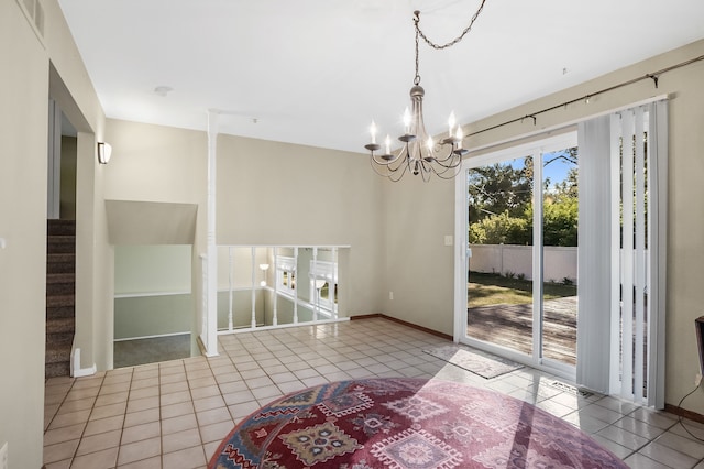 unfurnished dining area with light tile patterned floors and an inviting chandelier