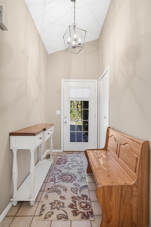 mudroom with light tile patterned floors, vaulted ceiling, and a notable chandelier