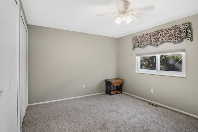 unfurnished bedroom featuring ceiling fan, a closet, and carpet floors