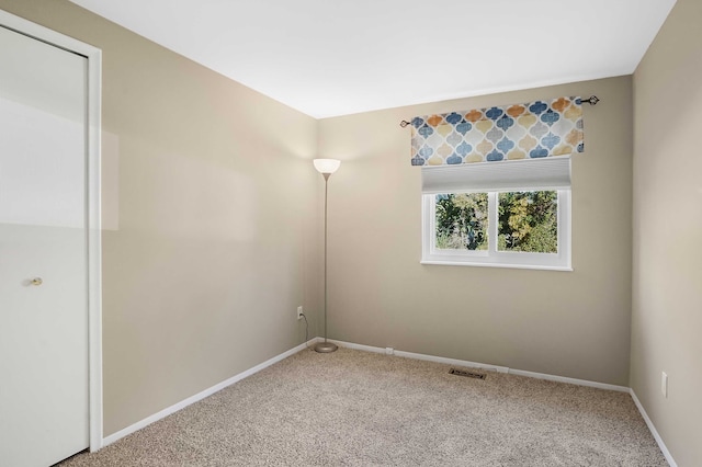 unfurnished room with carpet floors