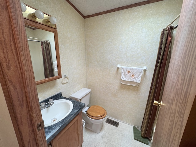 bathroom featuring crown molding, vanity, a shower with shower curtain, and toilet