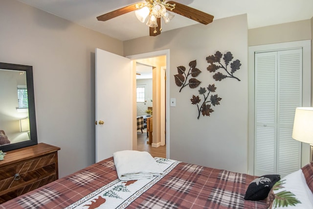 bedroom featuring ceiling fan and a closet