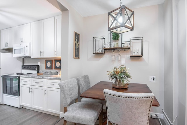 dining area with light wood-type flooring