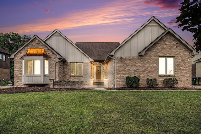 view of front of home with a lawn